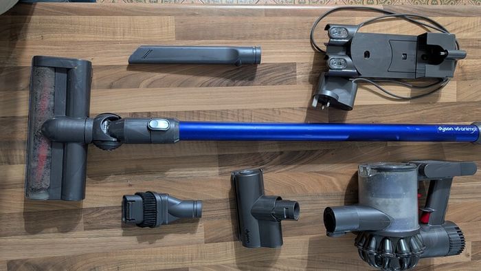 Dyson V6 handheld vacuum cleaner with charger and accessories