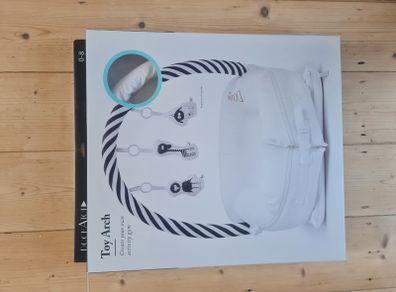 Dockatot Toy Arch and Toys