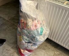 Big bag of baby clothes