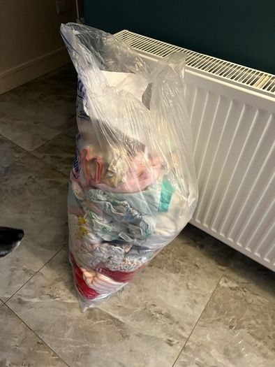 Big bag of baby clothes