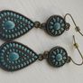 Vintage-style long bohemian drop earrings featuring turquoise enamel and a bronze-tone metal finish. Image 4