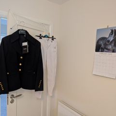 Women's showjumping jacket and jodhpurs