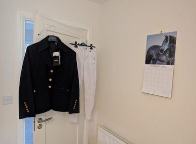 Women's showjumping jacket and jodhpurs