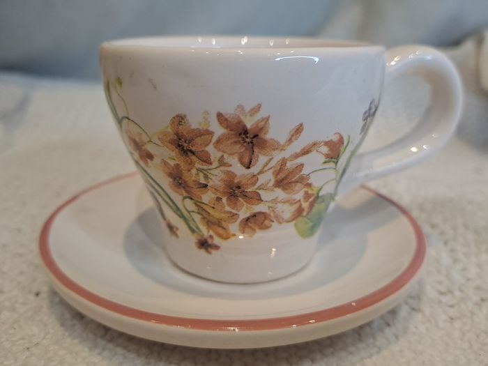 Miniature vintage teacup and saucer with candle