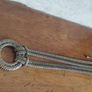 Vintage necklace with a pendant in the form of a ring and links in the form of a snake in gold tone. Image 7