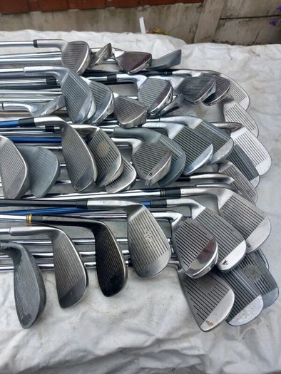 A selection of golf clubs and bags. NOT SELLING SEPARATE