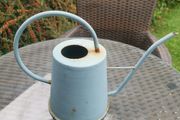 Watering can light blue. Metallic.