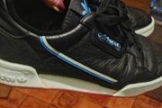 beautiful black leather Adidas runners