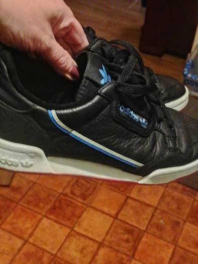 beautiful black leather Adidas runners