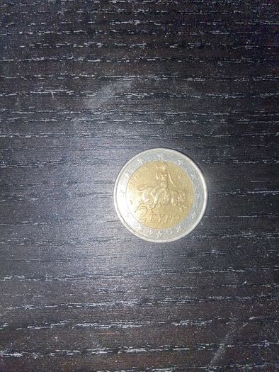 Greek man riding a bull 2 euro coin with S marking in the bottom star 2002