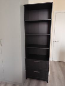 Shelf unit with drawers.