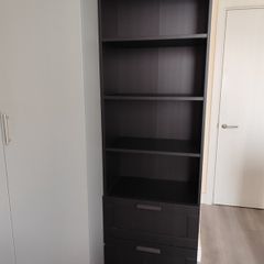 Shelf unit with drawers.