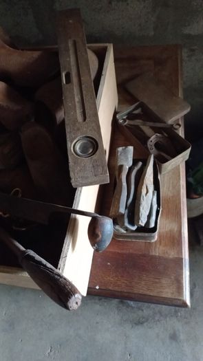 Antique wooden clogs and clog making tools
