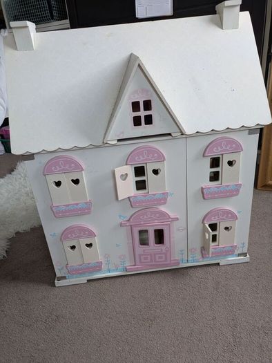 wooden doll house with furniture
