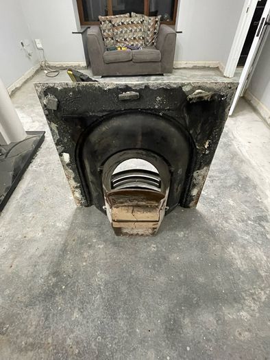 Victorian-style cast iron fireplace insert, surround and hearth