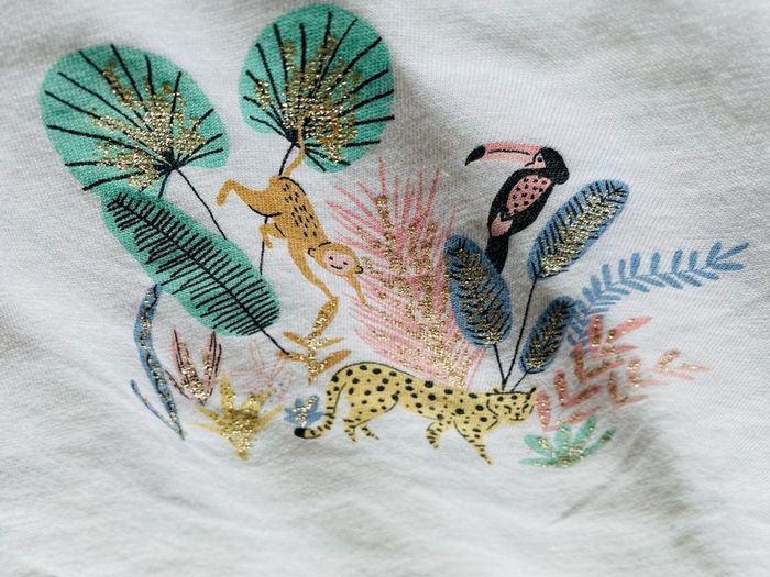 White T shirt with sparkly jungle print 12-18 months