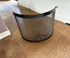 Contemporary black curved fire guard