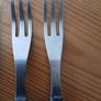 A 12-piece stainless steel steak knife and fork set with wooden riveted handles. Image 8