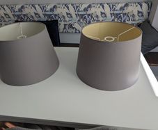 2 large grey lampshades