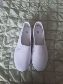 white canvas slip ons