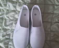 white canvas slip ons