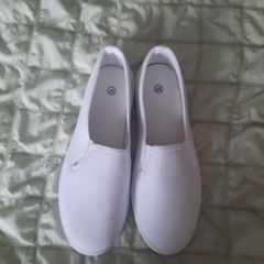 white canvas slip ons