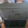 LG 42-inch Full HD Smart TV with a 3-tier black glass TV stand. Image 2
