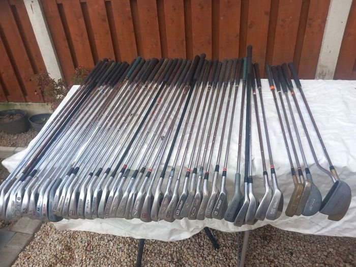 A selection of golf clubs and bags. Golf balls