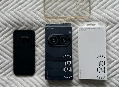 Near mint Nothing Phone 2(A)12gb ram 256gb storage bundle comes with used charger and phone case and brand new screen protector!