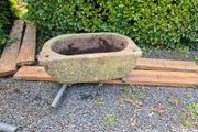 Trough, bathtub shaped.