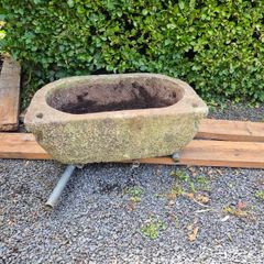 Trough, bathtub shaped.