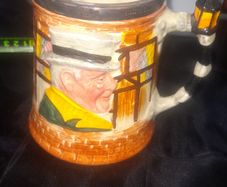 A Beautiful Old Collectable Ceramic tankard featuring characters from Charles Dickens novels Sam Weller and Sairey Gamp