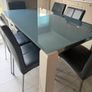 Glass topped dining table and six chairs Image 3