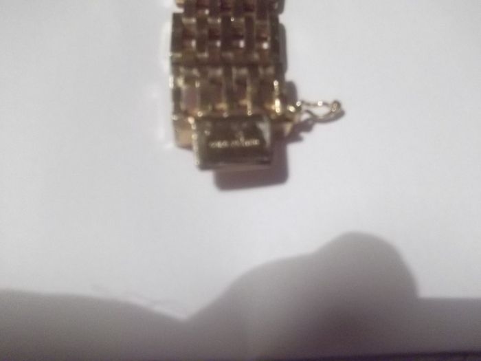 a heavy gold plated gate bracelet