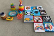 Baby toys, stacking rings and boxes and a selection of books