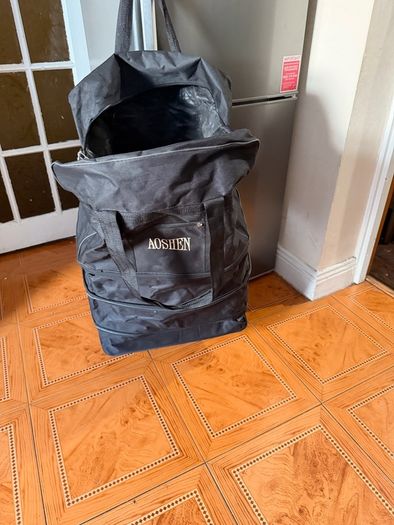 Two extra-large wheeled bags for organizing things; only one zipper doesn't work, but replacing it will make them like new.