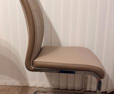 A set of 6 Dining room leather chairs with chrome frames