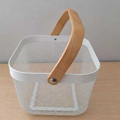 White wire storage basket with wooden handle