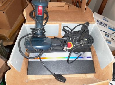 Atari 2600 junior colour console two joysticks,a quick shot controller all cables and wires + 9 games