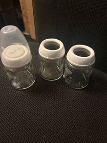 Breast pump, glass bottles and milk containers