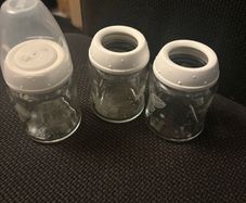 Breast pump, glass bottles and milk containers