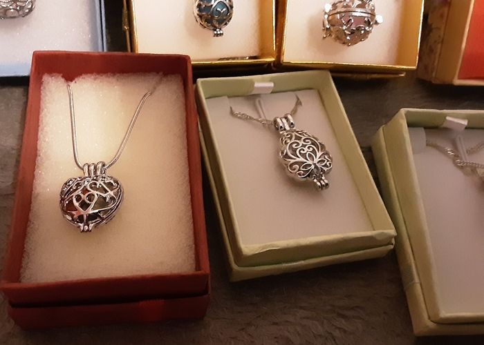 selection of homemade white metal necklaces