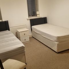 Two single beds with headboard
