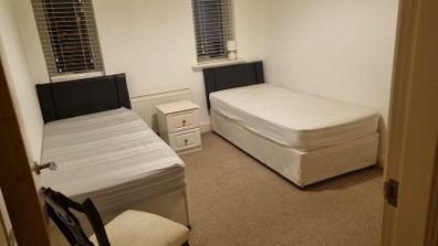 Two single beds with headboard