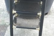 a 3 tier glass table iron frame