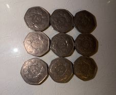 coins circle of hands 50p x 9
