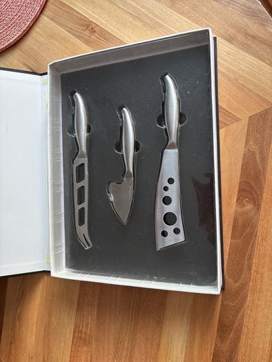 cheese board with cheese knives