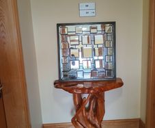 Faceted and Bevelled Bronze Framed Arts and Crafts Style Mirror.