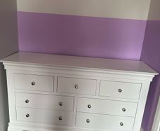 White wood chest of drawers.