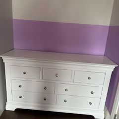 White wood chest of drawers.